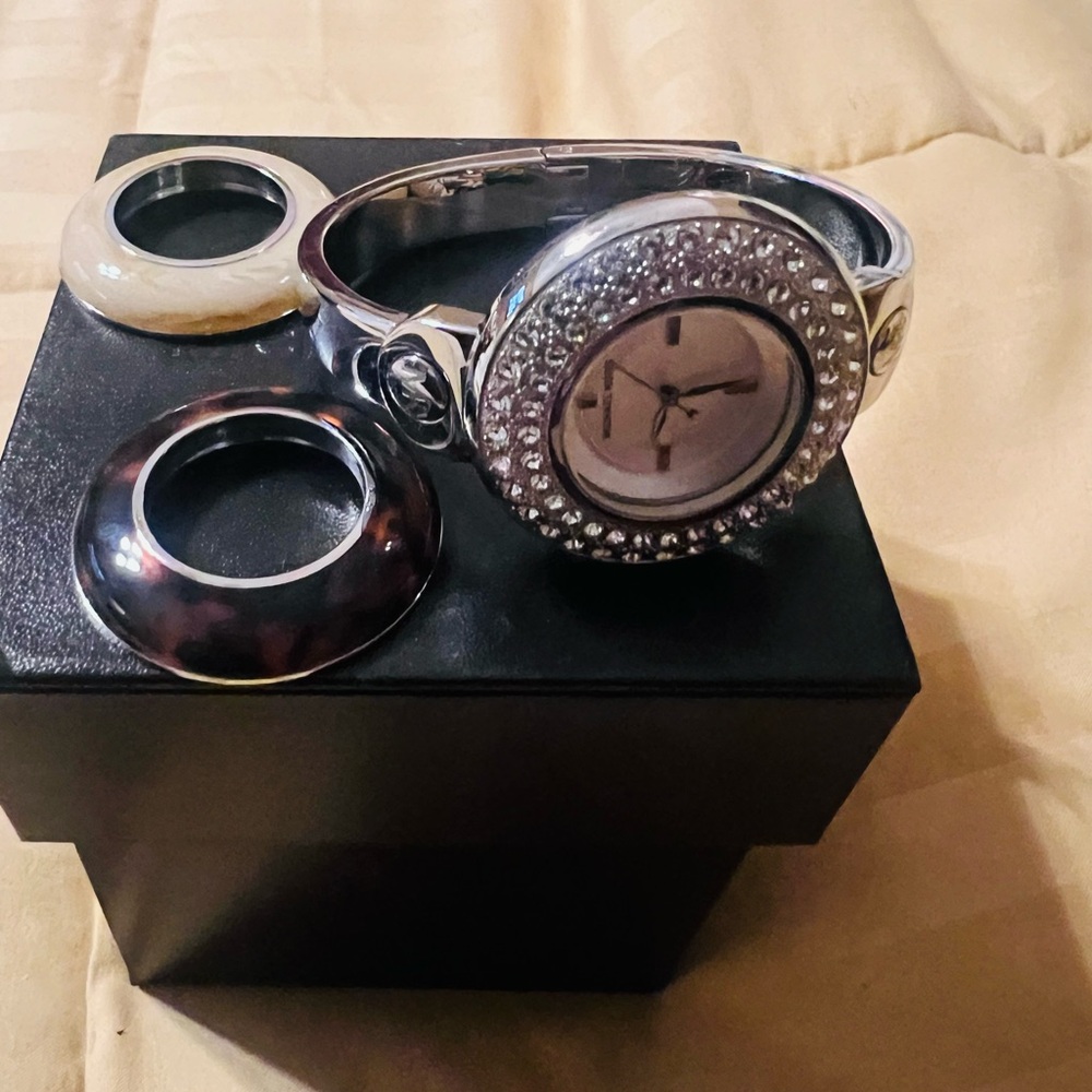 Michael Kors Watch with interchangeable faces.